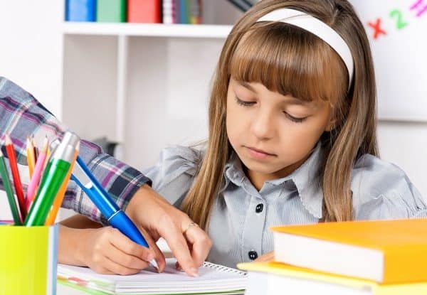 A child working with an in-person writing tutor in Arlington, VA